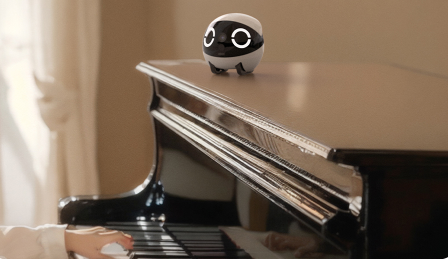 ROLA Mini companion robot on the piano